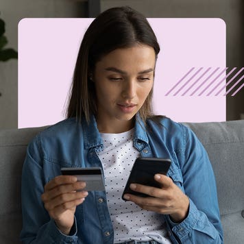 Design element of a person holding a phone in one hand and a credit card in another