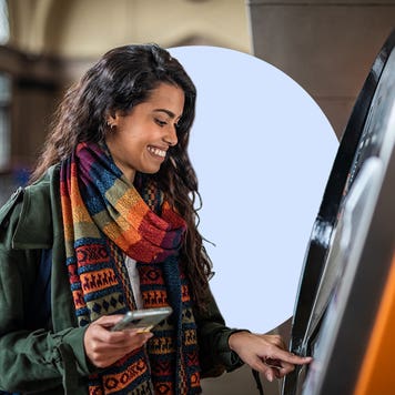 Young woman using the ATM