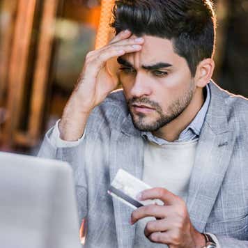 Young man having more expenses than expected.