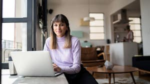 Person looking at laptop screen.
