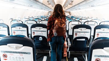 woman deboarding a commercial plane