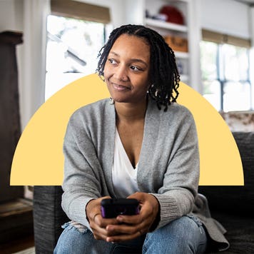 Woman sitting down on a couch