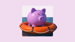 Image of a round pink piggybank in a life raft floating on water.
