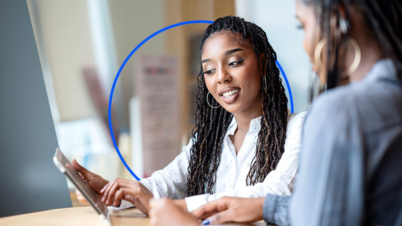 A financial advisor meeting with clients