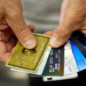 Person holding credit cards