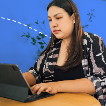 Asian women using laptop computer at home working space.
